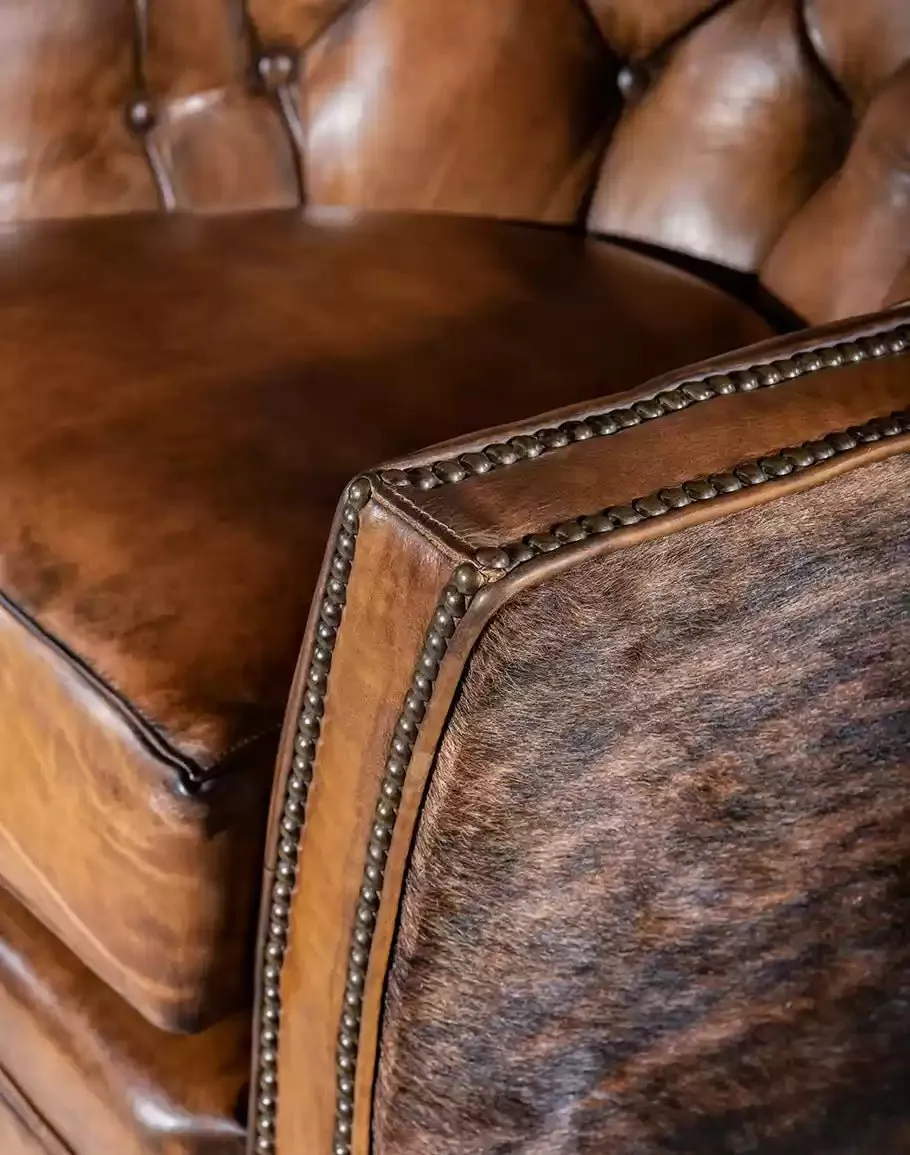 Brindle Cowhide & Tufted Leather Swivel Glider